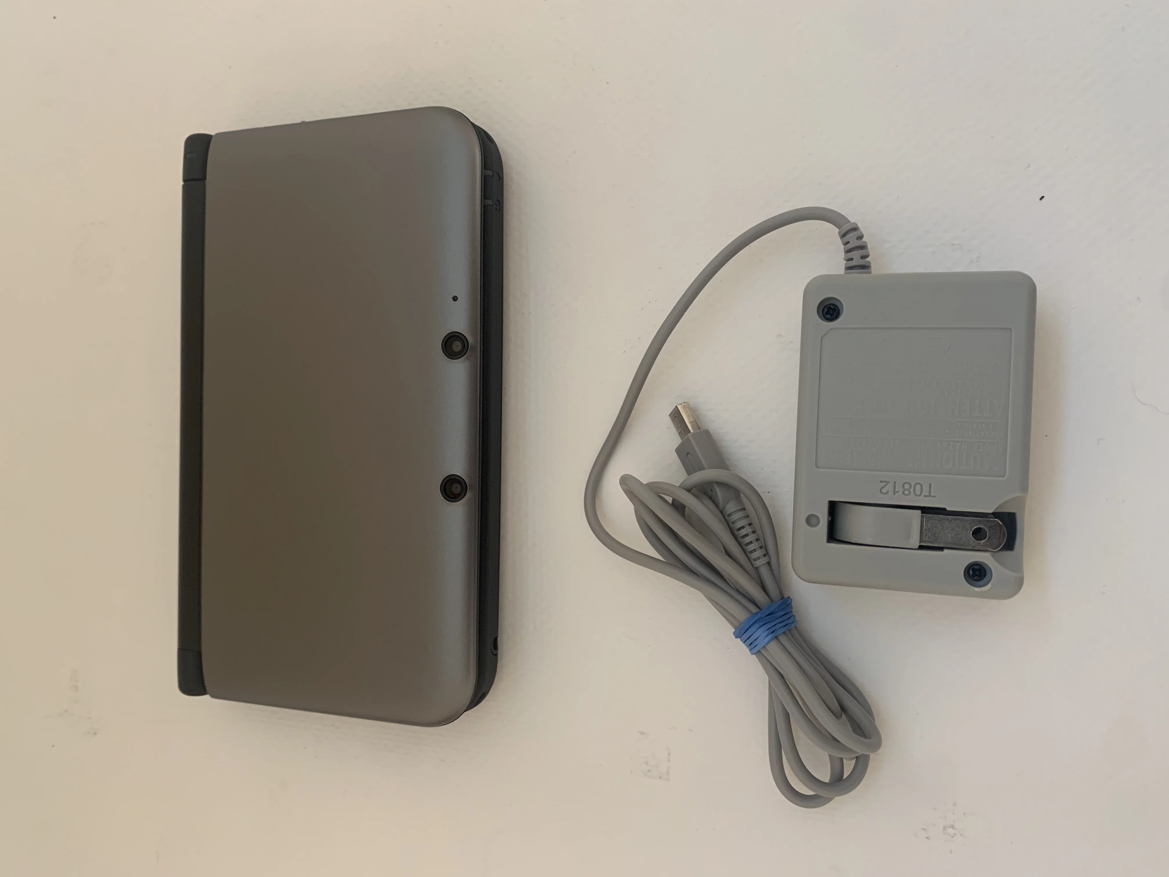 UsedNintendo 3DS XL Gun Metal Video Game Console with Stylus, Charger and 16 GB SD Memory Card