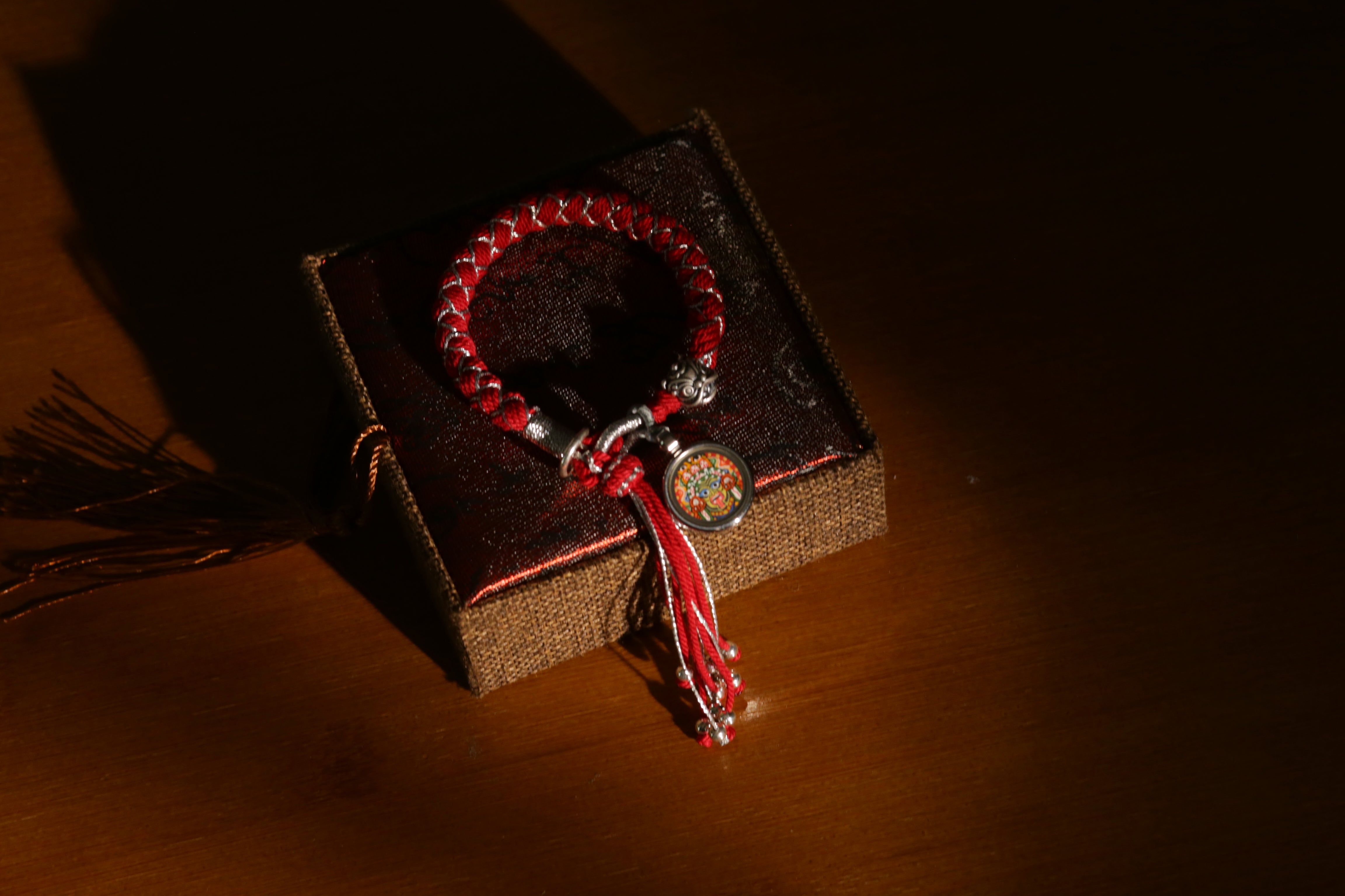 Zashi Lhamo Wealth Thangka Bracelet – Red Cord
