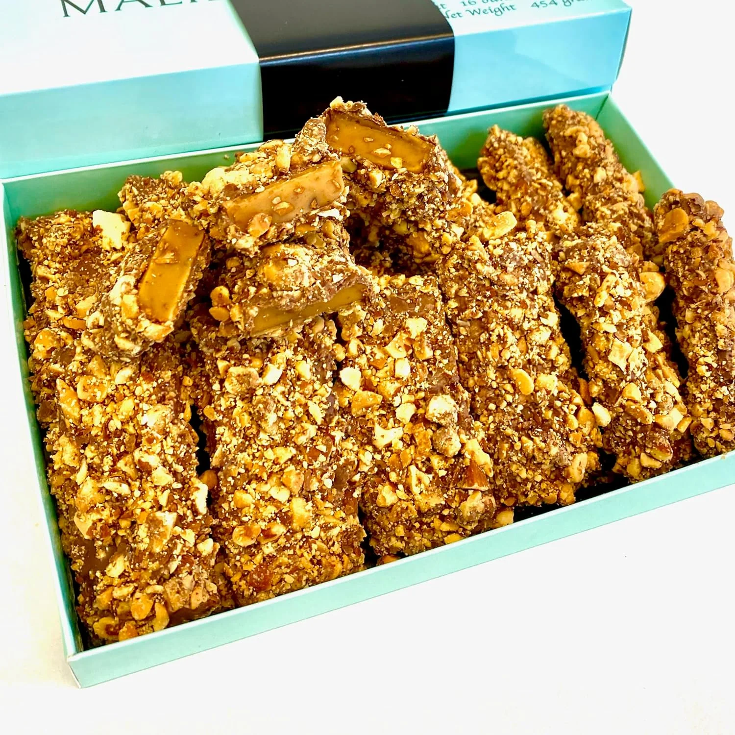 MalibuGift Gourmet English Toffee Candy rolled in Dark Chocolate and Roasted Almonds.