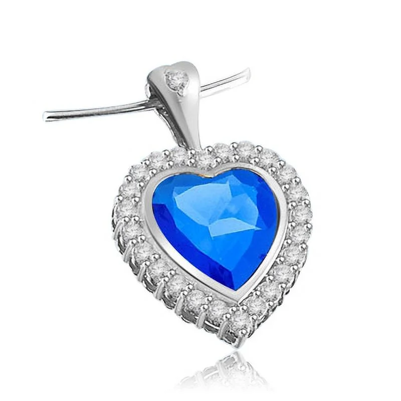 Bezel Set Heart Pendant with Synthetic Sapphire Essence in Center and Round Brilliant Melee Diamonds by Diamond Essence set in Sterling Silver