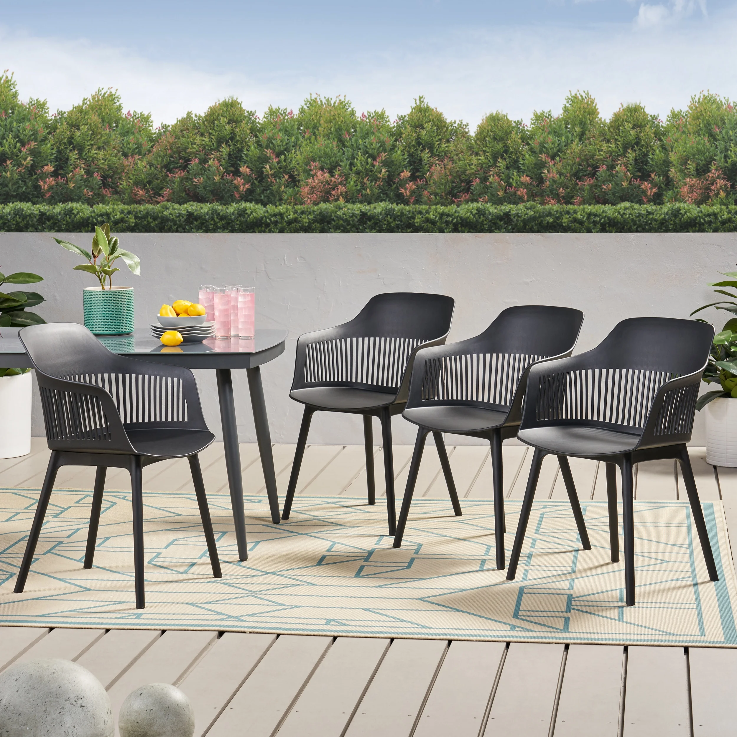 Noble House Dahlia Plastic Patio Dining Arm Chair in Black (Set of 4)