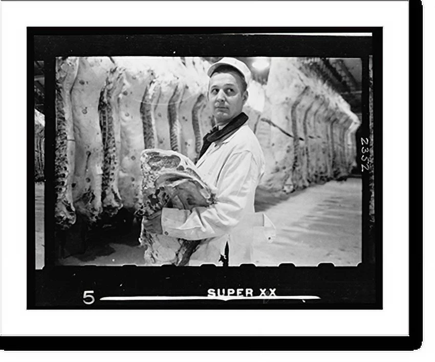 Historic Framed Print, [Butcher holding slab of beef in a meat locker], 17-7/8