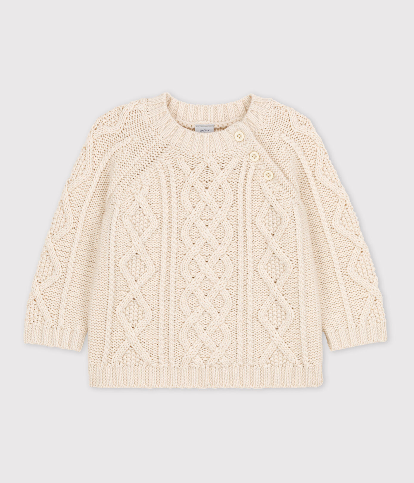 Pull bébé en tricot de coton à torsades